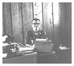the Mad Clerk at his desk -- 151st TC orderly room