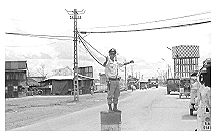 Not so fast, GI!' Traffic cop in Bien Hoa village